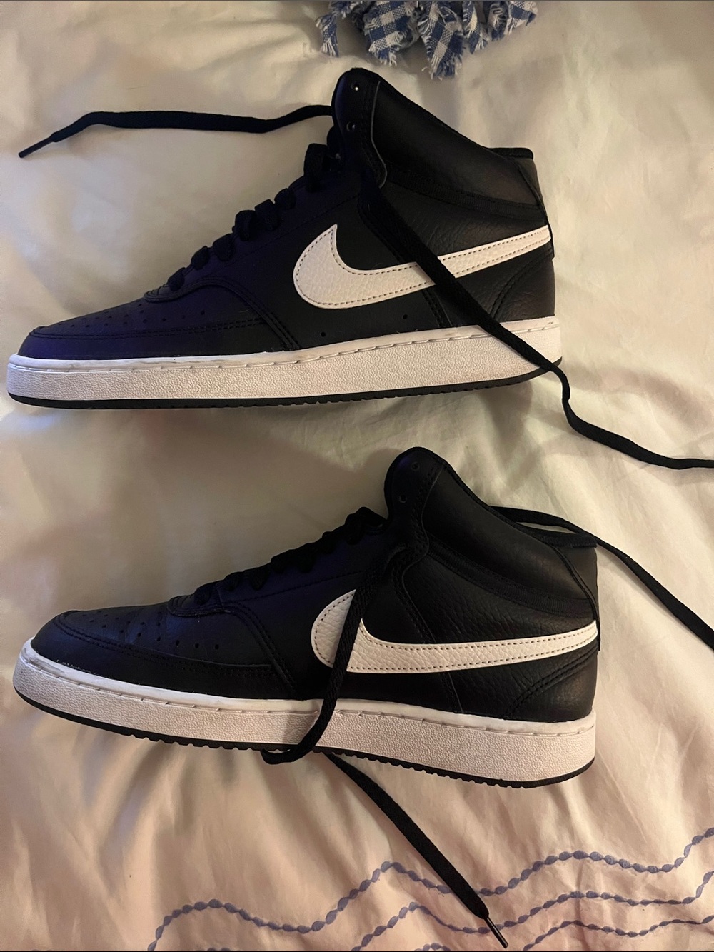 Nike Women’s Black and White High-Top Sneakers